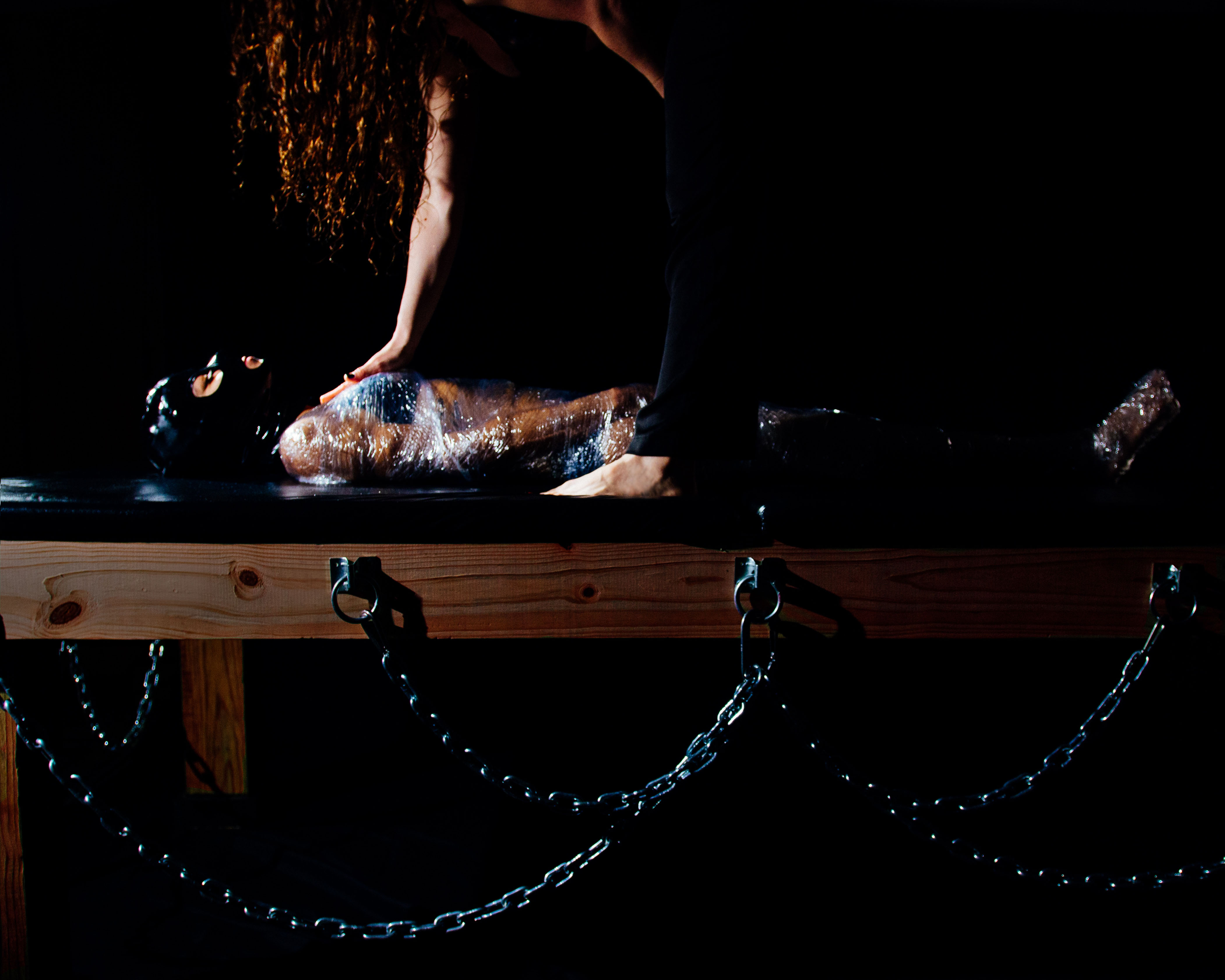 chicago dominatrix bondage table submissive mummification sensory deprivation chains saran wrap dominatrix